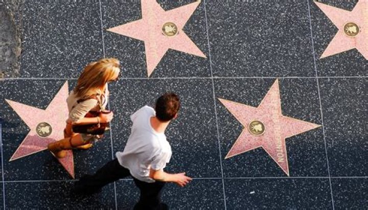 Who owns the Hollywood Walk of Fame?